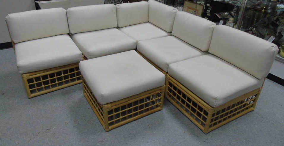 Contemporary Rattan Sectional w/ Beige Cushions: Rattan sectional with beige ribbed textured cushions. Sectional is 30" deep. 6 pieces total. End section is 30" x 30". 4 seats are 26" W x 30" D. One ottoman is 26" Wx 30" deep.