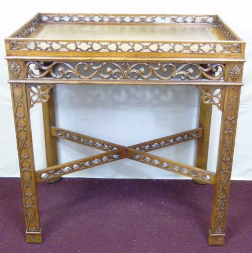 Maitland Smith Chinese Chippendale End Table: Contemporary Maitland Smith Chinese Chippendale End Table. Embossed gold green leather top. Heavily carved wood frame. Marked. Measures 28 x 27 x 17 inches.