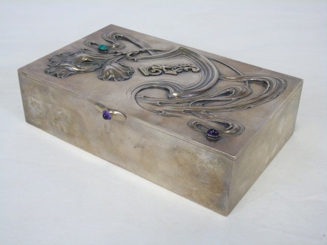 Antique Imperial Russian Faberge Silver Box: Antique Imperial Russian Faberge Silver Box in the Art Nouveau Style. Having cabochon stones and Art Nouveau floral motif at top. Hallmarked for maker. Interior with gilt wash. Measures 4.75 by 8 inch