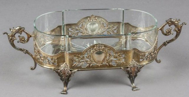 Imperial Russian Silver Centerpiece Grachev: Imperial Russian silver and glass centerpiece. The Centerpiece with scrolled floral work around on four chased feet and two ornate handles. The shaped glass with the star rays on the bottom. Hallmarke
