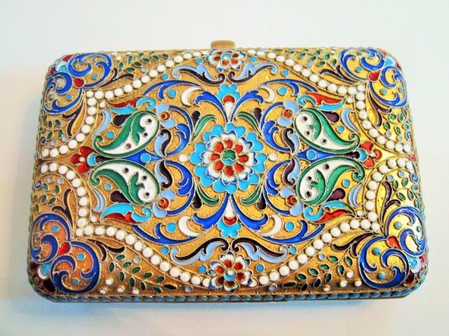 Imperial Russian Silver Cloisonne Enamel Cig Case: Large Imperial Russian gilded silver and cloisonne enamel cigarette case. The cigarette case with foliate and floral enamel design on both side. Round turquoise color jewels around both parts. Gilded 