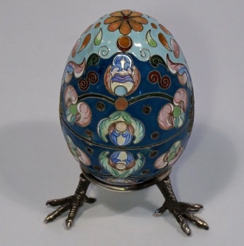 Russian Silver & Enamel Easter Egg: Russian silver and shaded enamel Easter egg. The egg consist of two parts with gilded interior. Fully enameled with floral design. Size : 3 3/4" ( 9,5 cm ) height with stand, 3" ( 7,5 cm ) without. We