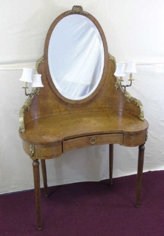 Antique French Burled Wood Vanity w/ Mirror: Antique French burled wood vanity with tilt mirror. Kidney shaped. One drawer with antique brass hardware. Carved antique brass applied detail. 38" W x 21" D x 29" H. 62" to top of mirror.