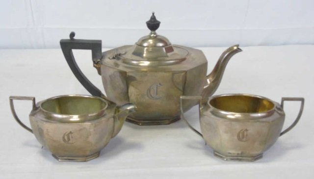 Antique Birks Sterling Silver Tea Service: Antique Birks Sterling Silver Tea Service. Each hallmarked BIRKS and STERLING. Pot with ebony wood handle and finial. Vermeil gilt interior finish. Measures 6.5 inches in height, 11 inches in length,
