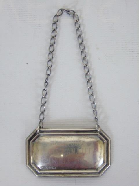 Lot of 8 Sterling Silver & Glass Coasters: Lot of eight Sterling Silver and Glass Coasters. 3" diameter. Included is a sterling bottle label.