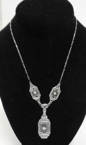 Edwardian Style Diamond & Camphor Glass Necklace: Edwardian style sterling silver, diamond, an camphor glass necklace. Large pendant with two smaller panels on delicate chain. Necklace length including chain and pendants measures 18 inches.