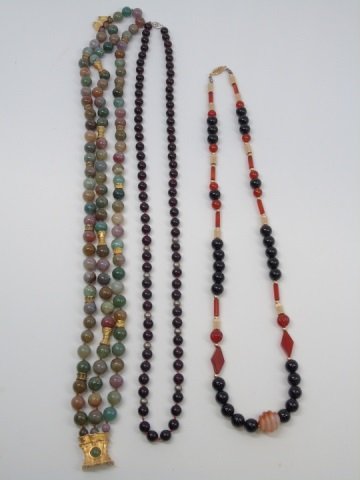 3 Vintage Jade Onyx & Hardstone Necklaces: 3 Vintage Jade Onyx & Hardstone Necklaces. Jade and hardstone necklace with gold tone clasp, hand knotted onyx bead necklace with silver clasp, onyx / carnelian and vermeil clasp. Longest measures 32 