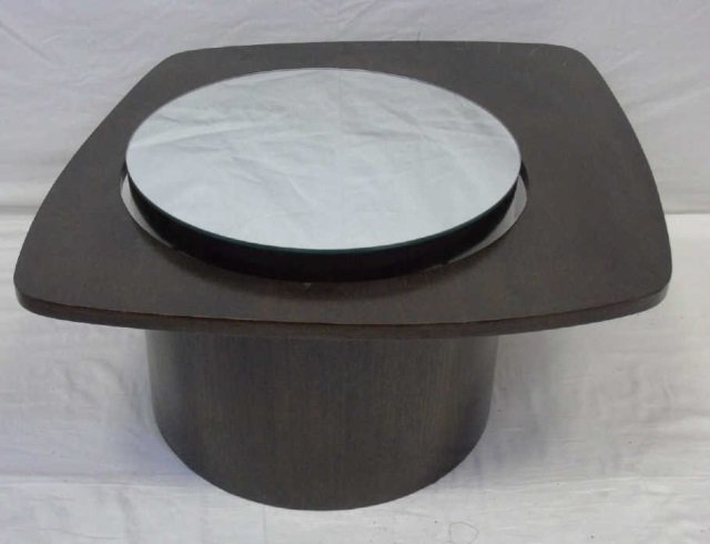 Mid Century Modern Coffee Table: Mid century modern coffee table. Round drum base has mirror top. Dark stained finish. 32" x 32" x 15 1/2" H. Off center mirror is 20" diameter.