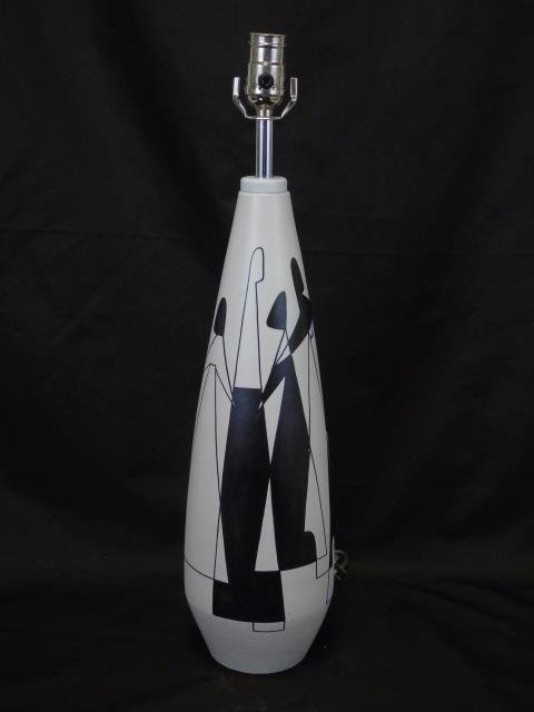 Mid Century Modern Black & White Painted Pottery: Mid 20th Century Modern Black and White Painted Pottery Lamp. Abstract images on bowling pin shaped body. 5" diameter x 22" H.