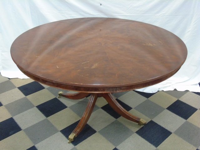 Mahogany Regency Style Center Hall / Dining Table: Mahogany Regency Center Hall / Dining Table. Pedestal base. Brass casters. 54" diameter x 30" H.