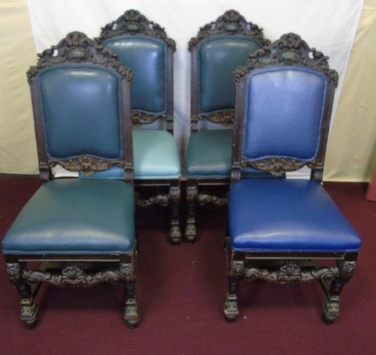 Set of 4 Antique Rococo Revival Side Chairs: Set of Four Rococo Revival Side Chairs. Heavily carved mahogany with cartouche and shell design. Teal vinyl upholstery. 19" W x 19" D x 43" H.