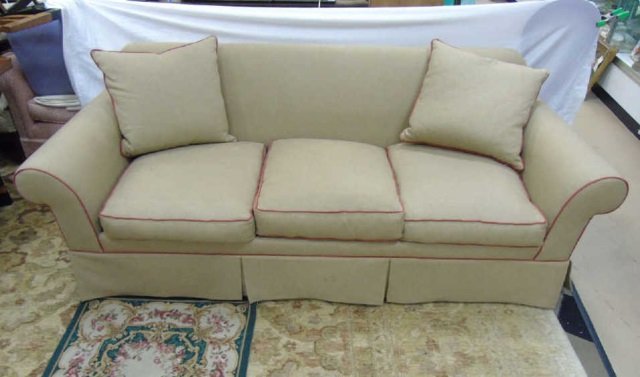 Contemporary Custom Made Rolled Arm Sofa: Contemporary Custom Made Rolled Arm Sofa. Custom upholstery work with contrast piping. Clean and of recent make. Measures 31 x 84 x 35 inches.