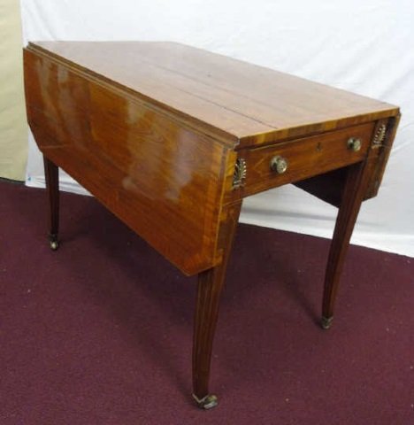 Early 20th Century Rosewood Pembroke End Table: Early 20th century rosewood Pembroke end table. Parquetry embellishment and banding. Antique brass hardware. Brass casters on tapered legs. A drawer on each side. With dropped leaves 22" W, fully open