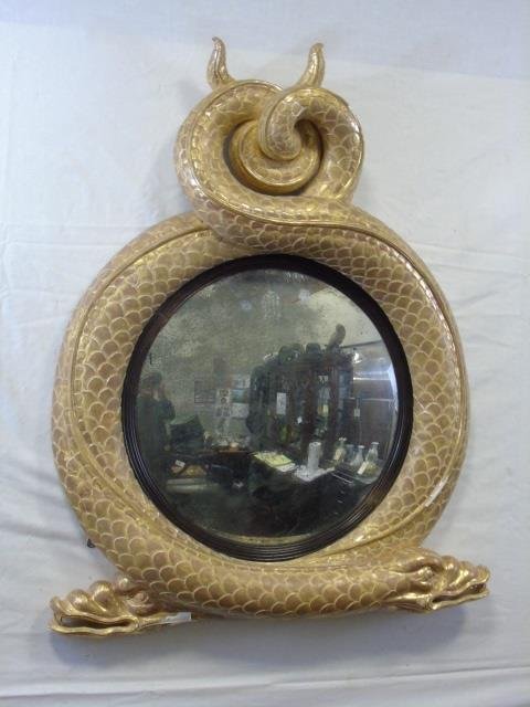 Antique Entwined Serpent Mirror Gold Leaf Finish: Carved wood / gesso intertwined serpents framed mirror. Large "scale" detail. Gold leaf finish. Mirror is convex with some antiquing. 30" wide at bottom x 38" H x 4 1/2" D.