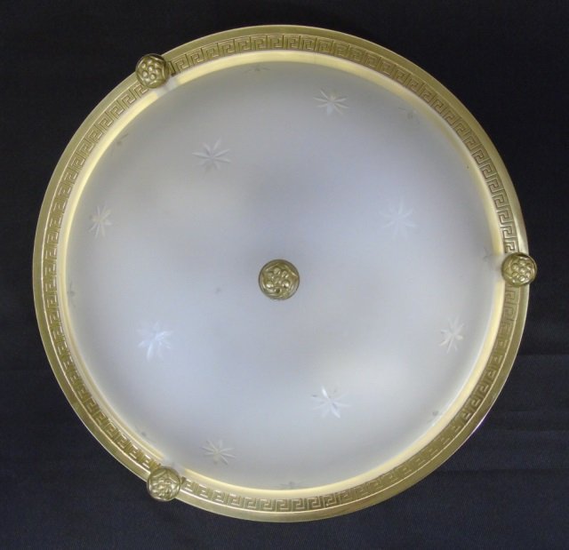 Vaughan Flush Mount Ceiling Light Fixture: Vaughan (in the D & D building) flush mount ceiling light fixture. Frosted glass with etched stars. Brushed brass back plate with Greek key motif. 11" diameter x 3" H. Good condition.