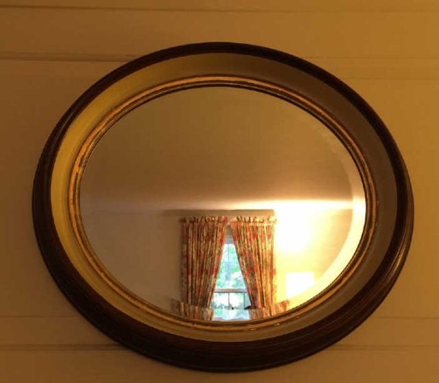Antique Convex Glass Oval Mirror: Antique Convex Glass Oval Mirror. Mahogany and painted frame. Measures 22.5 by 19.5 inches.