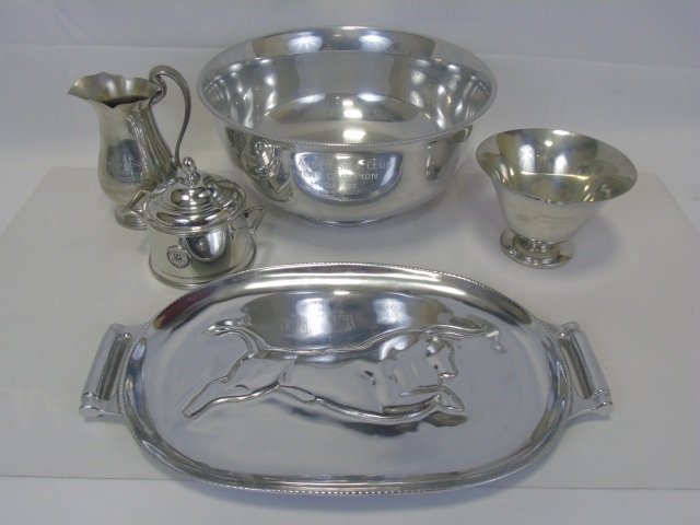 Lot of 4 Pewter Golf Trophies & 1 Pewter Platter: Lot of four pewter golf trophies and one platter with bull image. Large punch bowl is a championship trophy from Innis Arden Club in Greenwich,Connecticut. 14 1/2" diameter x 7" H. platter is 19 1/2" 