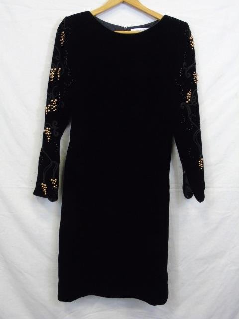 Mary McFadden Black Velvet Cocktail Dress Size 4: Vintage Mary McFadden black velvet cocktail dress with bead and soutache detail on sleeves. Zip back. Size 4. Shoulder to shoulder measures 15". Overall length shoulder to hem is 39". Item needs to be