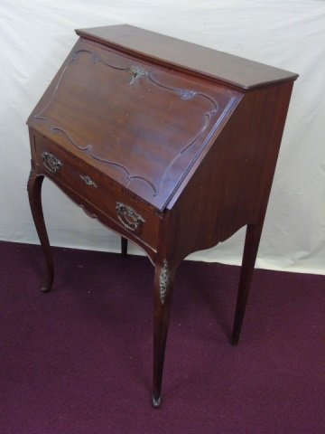Antique Mahogany Drop Front Desk: Mahogany drop front desk. Graceful cabriole legs with ormolu mounts. Fancy hardware. Single drawer. Interior has two drawers. 27 1/2" W x 16" D x 39" H.