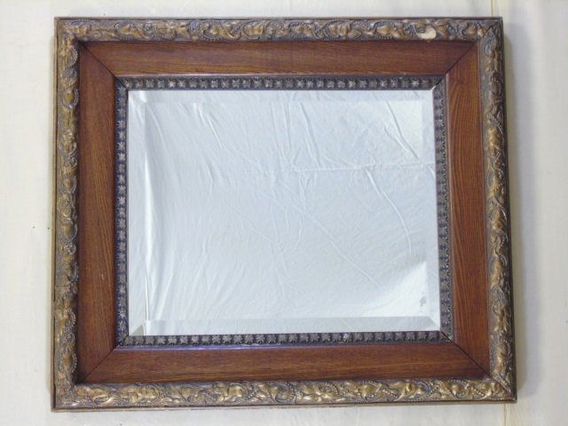 Vintage Carved Wood Framed Mirror: Vintage carved wood framed beveled mirror. Finish has a touch of gilt. Floret bead detail. 25" W x 30" H. Needs a repair.