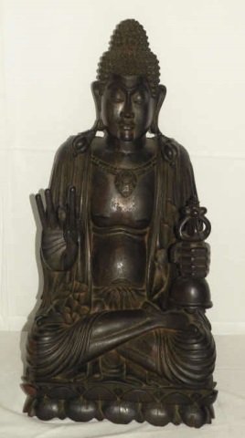 Seated Carved Wood Balinese Buddha: Seated carved wood Balinese Buddha. 12" W x 11" D x 26" H. Very good condition. One broken finger.
