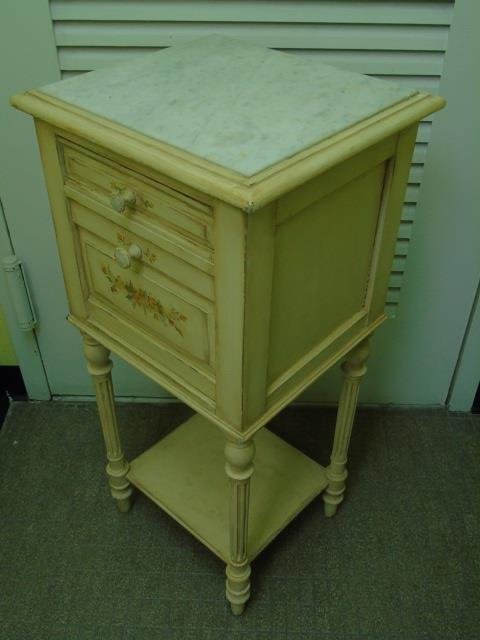 Floral Painted Powder Room Cabinet / Nightstand: Painted powder room cabinet / nightstand. Marble top. One cabinet with drop door. One drawer. Lower shelf. Fluted legs. 15" W x 14" D x 33" H.