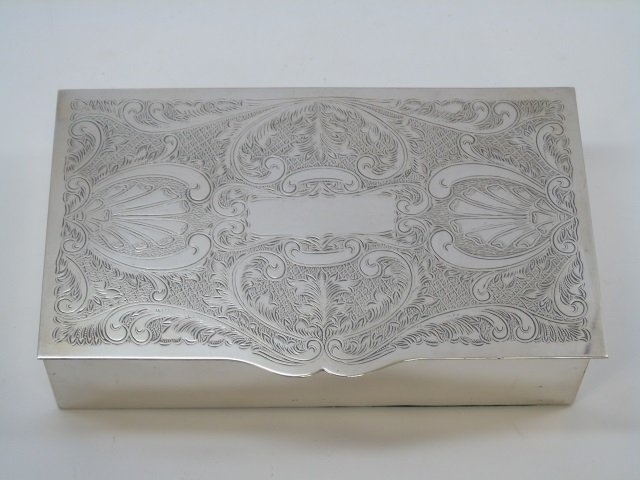 Sheffield England Silver Plate Chased Table Box: Sheffield England Silver Plate Chased Table Box. Having Rococo design elements. Interior lined with wood and hallmarked. Measures 7.5 by 4.5 inches.