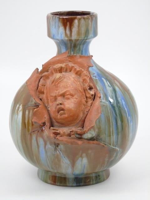 Handmade German Glazed Vase w/ Cherub: German glazed vase with sculpted unglazed terracotta cherub. 5 1/2" diameter x 8" H.