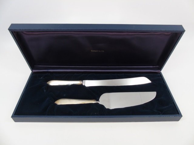 Boxed Tiffany & Co Sterling Silver Serving Utensil: Boxed Tiffany & Co Sterling Silver Serving Utensils. New in box with dust covers. Hallmarked. Larger measures 12 inches.