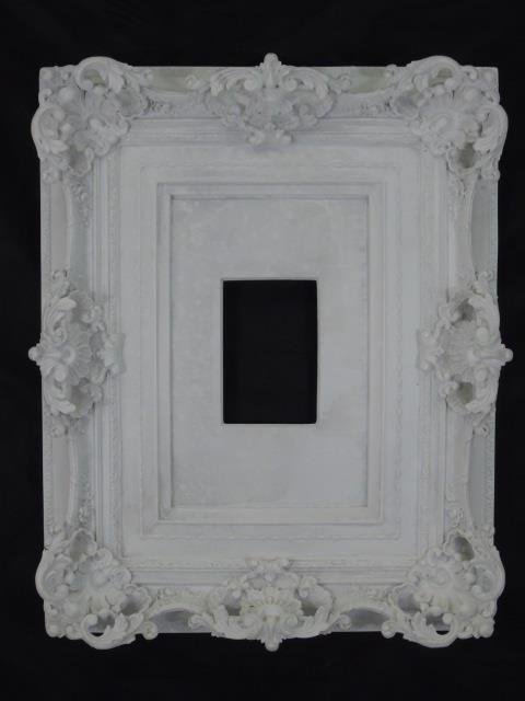 Contemporary Rococo Style Cast Marble Frame: Contemporary Rococo Style Cast Marble Frame. Areaware Home Decor. Crafted in resin and marble. Designed by Harry Allen. Holds a 4" x 6" picture. 23" x 18".