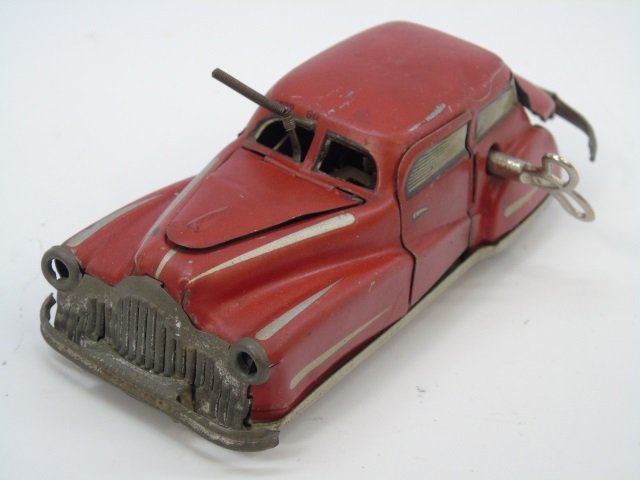 Vintage Joustra French Wind Up Tin Car: Vintage Joustra French Wind Up Tin Car. Marked JOUSTRA on bottom. With key. Measures 5.5 by 2 inches.