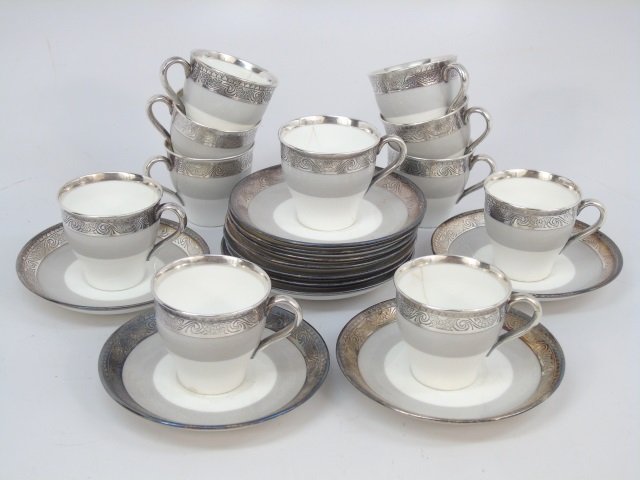 Mintons England Sterling Overlay Demitasse Set: Mintons England Sterling Overlay Demitasse Set. Each with sterling silver overlay on porcelain. Marked bottoms. Full service for 10 with extras. Saucers measures 4.25 inches in diameter.