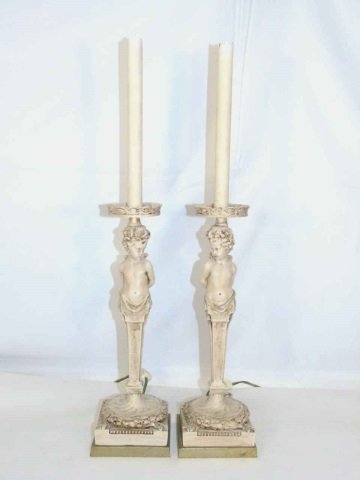 Pair Caryatid Putti Form Candlestick Table Lamps: Pair Caryatid Putti Form Candlestick Table Lamps. Painted to resemble limestone. Electrified. Each measures 24.5 inches in height.