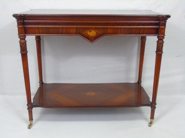 Contemporary Traditional Inlaid Wood End Table: Contemporary Traditional Inlaid Wood End Table. Inlaid with shell / cornucopia design. On casters. Top with book matched parquet design. Measures 27 x 38 x 18 inches.