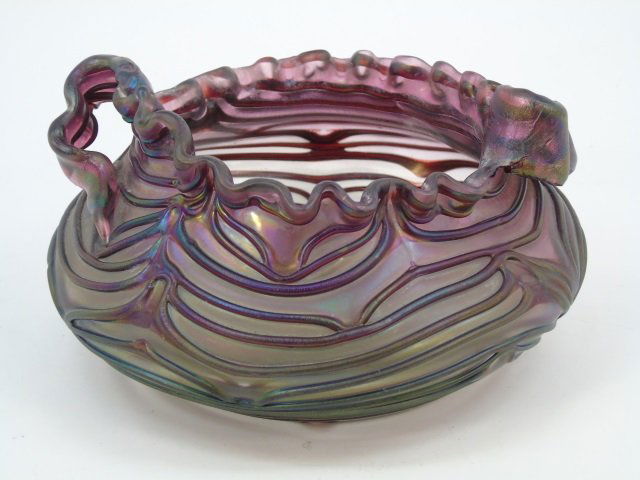 Antique Art Glass Continental / Loetz Style Urn: Antique Art Glass Continental / Loetz Style Urn / Handled Bowl. Unsigned. Measures 7 inches in diameter.