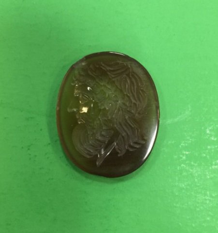 Antique Victorian Carved Intaglio of Homer: Antique Victorian Carved Intaglio of Homer. Likely a 19th century Grand Tour intaglio based off the famous bust of Homer now in the British Museum. Measures just under 1 inch in length.