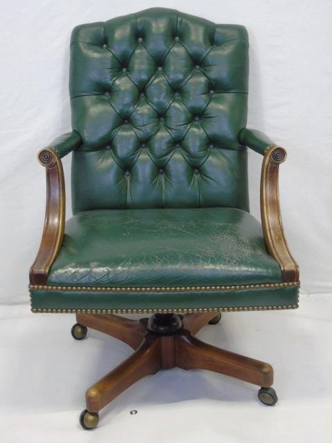 Vintage Tufted Green Leather Executive Desk Chair: Vintage Tufted Green Leather Executive Desk Chair. Wheeled swivel base. Measures 39 x 24 x 29 inches.