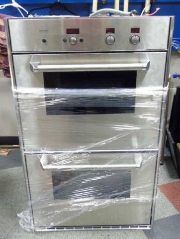 Thermador Stainless Steel Double Wall Oven: Thermador Stainless Steel Double Wall Oven. Measures 49 x 30 x 24.5 inches.