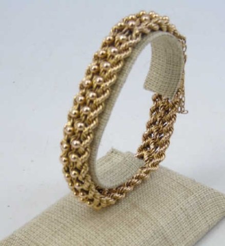 Estate 18kt Yellow Gold Rope & Ball Motif Bracelet: Estate 18kt Yellow Gold Rope & Ball Motif Bracelet. Hallmarked clasp. Safety chain. Measures approximately 7.5 inches in length. Weighs approximately 28 grams.