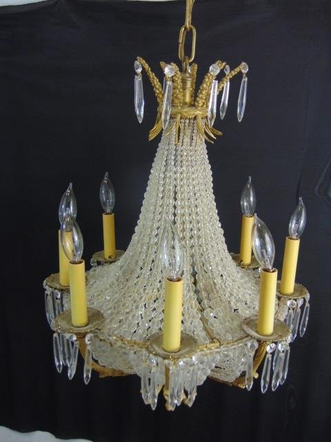Antique Neo Classical French Empire Chandelier: Antique Neo Classical French Empire Style Crystal Beaded Chandelier. Quality heavy gilt bronze ormolu frame with extensive crystal beadwork. Having eight arms. Measures 24 inches in height, plus chain