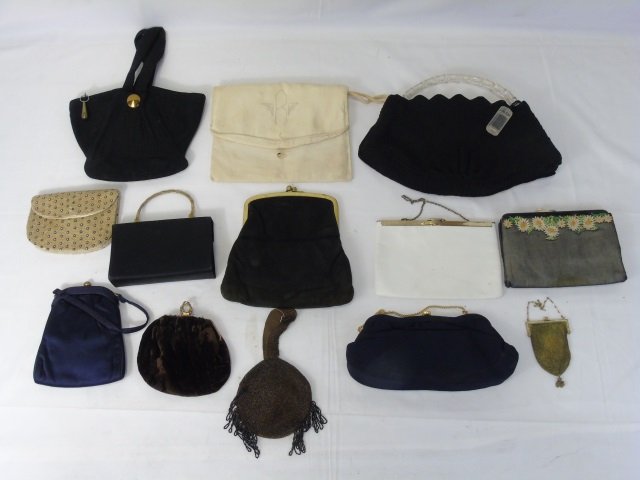 Collection of Antique & Vintage Purses & Handbags: Collection of Antique & Vintage Purses & Handbags. Including a whiting and davis style gold mesh purse, a lucite handle, beaded, fabric, etc. Largest measures 10 x 15 inches.