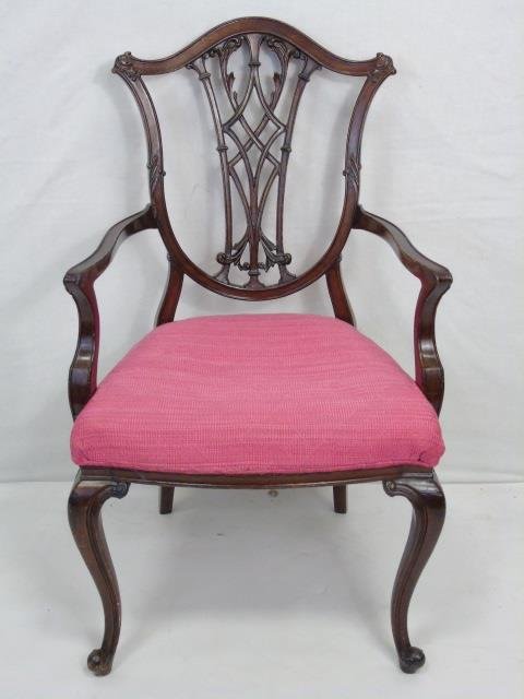 Diminutive Antique Chippendale Carved Armchair: Diminutive Antique Chippendale Style Carved Wood Armchair. Hand carved mahogany tone frame with upholstered cushion. Measures 34.5 x 21 x 16 inches.