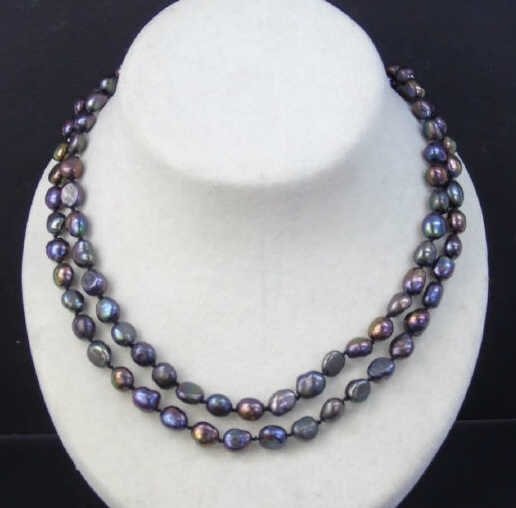 Pair Cultured Tahitian Black Pearl Necklace Strand: Pair Cultured Tahitian Black Pearl Necklace Strands. Cultured baroque Tahitian black pearl style beaded necklace strands with silver tone floral motif clasps. Each measures 18 inches.