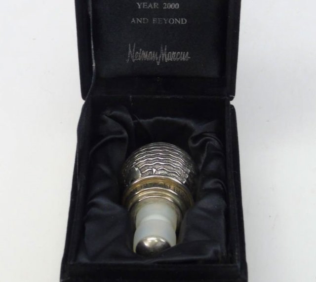 Neiman Marcus Boxed Silver Plate Wine Stopper: Neiman Marcus Boxed Silver Plate Wine Stopper. In fitted velvet box. Measures 3 inches in length.