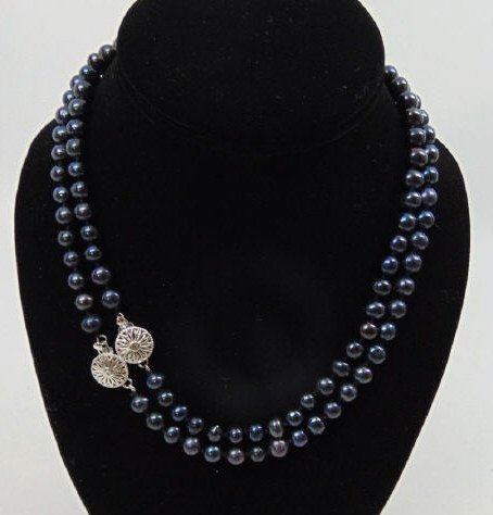 Pair Tahitian Black Cultured Pearl Necklaces: Pair Tahitian Black Cultured Pearl Necklaces w. Filigree Clasps. Each measures nearly 17 inches in length.