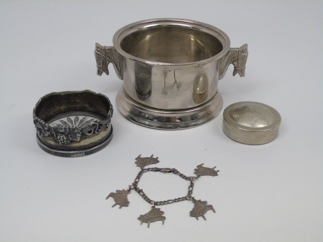 Lot of 4 Sterling & Silver Plate Items: Lot of four sterling and silver plate items. Included is a sterling "piano" charm bracelet, a sterling and cut crystal coaster, Argentine silver box and a silverplate wine coaster with horse handles.
