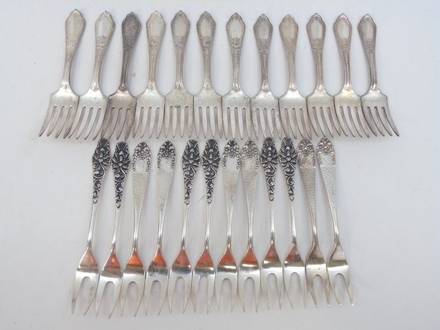 24 Antique Indonesian 800 Silver Appetizer Forks: 24 Antique Indonesian 800 Silver Appetizer Forks. Each measures 4.5 inches in length.