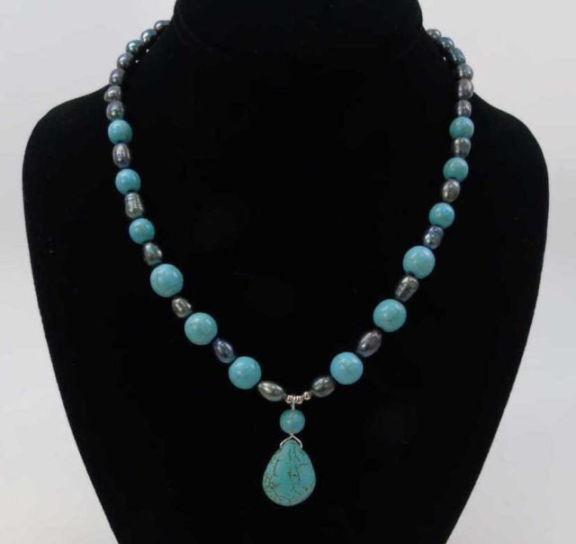 Turquoise & Tahitian Black Pearl Necklace: Beaded Turquoise & Cultured Tahitian Black Pearl Necklace w/ Pendant. Silver tone metal. Measures 18 inches in length.