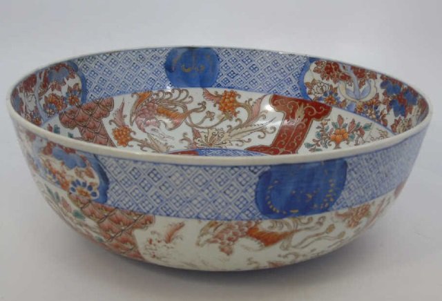 Large Antique Japanese Imari Porcelain Bowl: Large Antique Japanese Imari Porcelain Bowl. Hand painted design. Measures 4 x 12 inches.
