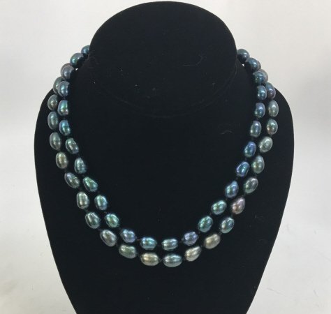 Pair Black Tahitian Baroque Pearl Necklace Strands: Pair Black Tahitian Style Baroque Pearl Necklace Strands. In tones of black, grey, silver and grey. Each measures 18 inches in length.